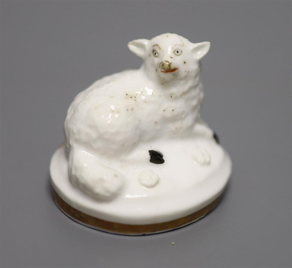 A Rockingham porcelain recumbent sheep, c.1830, height 3cm